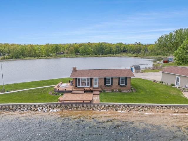 7394 N Keating Dr, Walkerville, MI 49459 - view of front of home with a deck with water view, a front yard, and brick siding