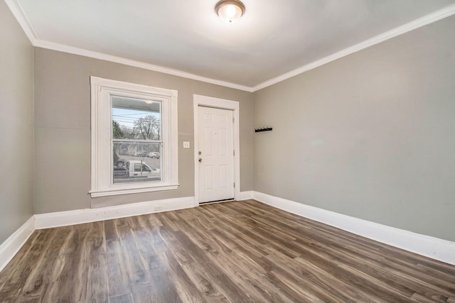 407 11th St NW Unit 409, Grand Rapids, MI 49504 - unfurnished room with crown molding, baseboards, and wood finished floors