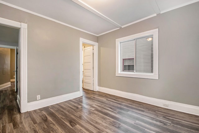 407 11th St NW Unit 409, Grand Rapids, MI 49504 - unfurnished room featuring crown molding, baseboards, and dark wood finished floors