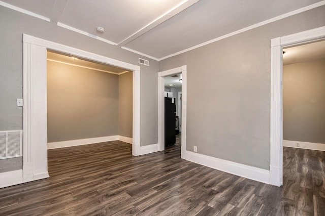 407 11th St NW Unit 409, Grand Rapids, MI 49504 - spare room with dark wood-style floors, baseboards, a smoke detector, and ornamental molding