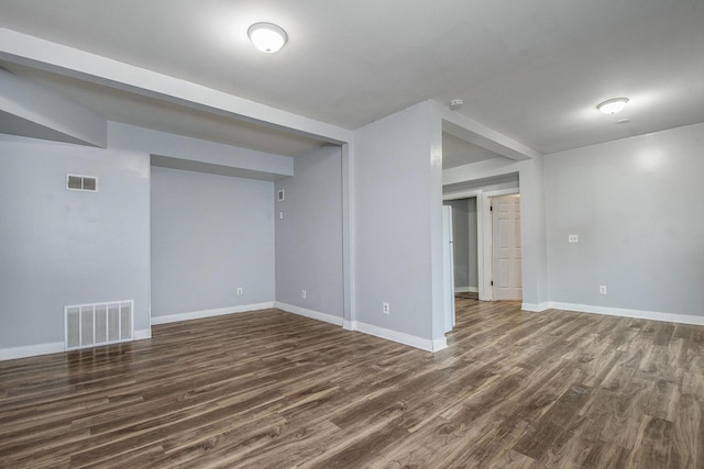 407 11th St NW Unit 409, Grand Rapids, MI 49504 - unfurnished room featuring dark wood finished floors, baseboards, and a smoke detector