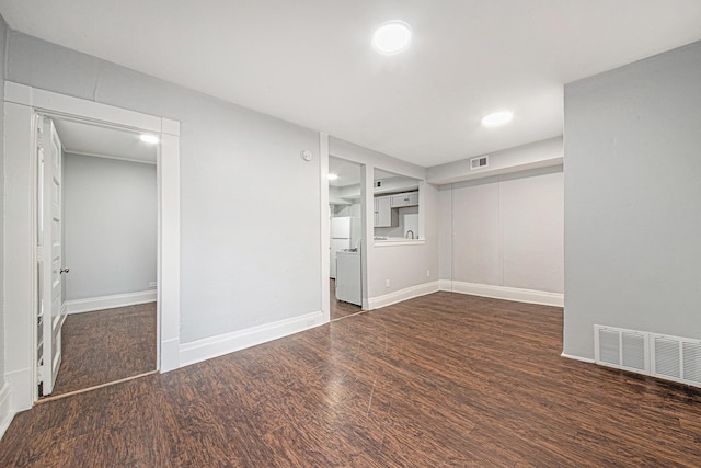 407 11th St NW Unit 409, Grand Rapids, MI 49504 - spare room with wood finished floors, baseboards, and recessed lighting