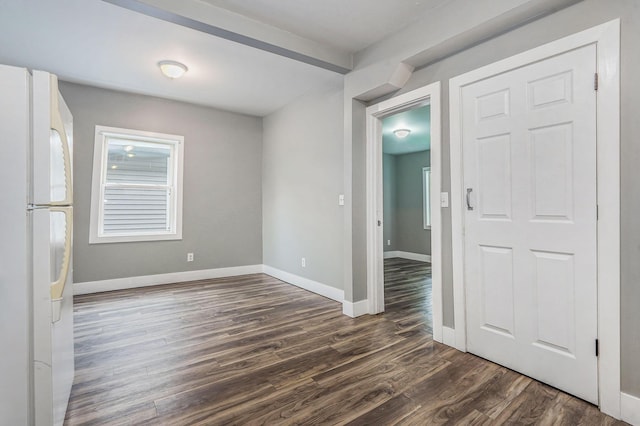 407 11th St NW Unit 409, Grand Rapids, MI 49504 - spare room with dark wood finished floors, baseboards, and plenty of natural light