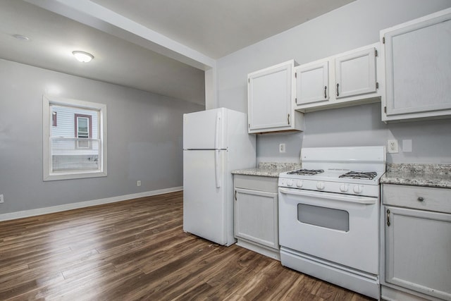 407 11th St NW Unit 409, Grand Rapids, MI 49504 - kitchen featuring white appliances, dark wood-style flooring, and baseboards