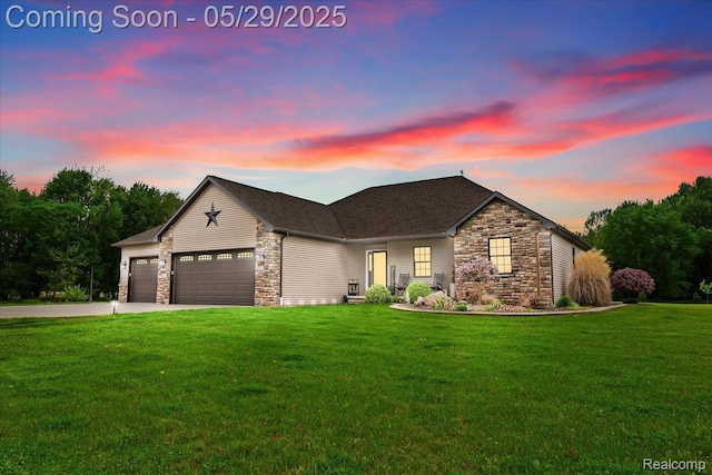 6035 Beard Rd, Byron, MI 48418 - view of front facade with stone siding, a lawn, a garage, and driveway