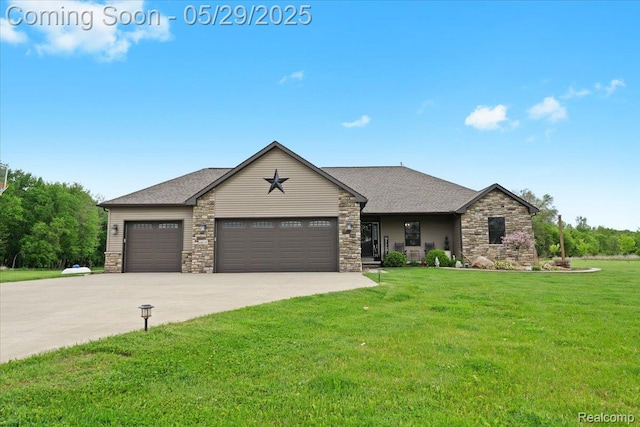 6035 Beard Rd, Byron, MI 48418 - view of front of property with a front yard, an attached garage, concrete driveway, and stone siding