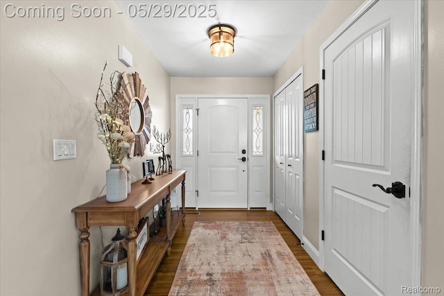 6035 Beard Rd, Byron, MI 48418 - entryway with dark wood-style flooring
