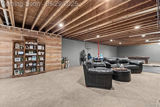 6035 Beard Rd, Byron, MI 48418 - living room featuring carpet flooring and wooden walls