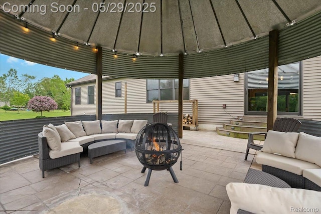 6035 Beard Rd, Byron, MI 48418 - view of patio / terrace with an outdoor living space with a fire pit, a gazebo, and entry steps