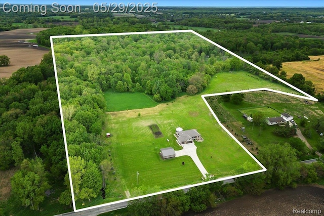 6035 Beard Rd, Byron, MI 48418 - overview of rural landscape featuring property parcel outlined and a heavily wooded area