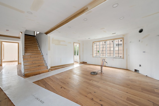 1395 Northlawn Blvd, Birmingham, MI 48009 - unfurnished living room with stairs, light wood finished floors, and recessed lighting