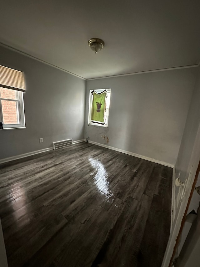 8603 Whitcomb St, Detroit, MI 48228 - unfurnished room featuring healthy amount of natural light, dark wood-style floors, and baseboards