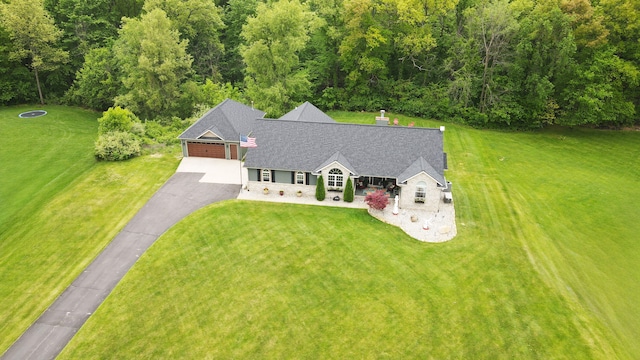 2363 Sundance Rdg, Howell, MI 48843 - aerial view of property and surrounding area with a heavily wooded area