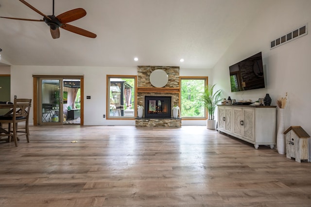 2363 Sundance Rdg, Howell, MI 48843 - living area with healthy amount of natural light, ceiling fan, wood finished floors, recessed lighting, and a large fireplace