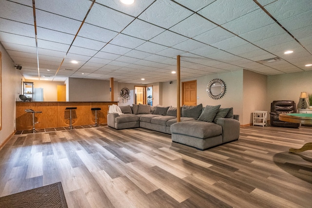 2363 Sundance Rdg, Howell, MI 48843 - living area with wood finished floors, recessed lighting, a dry bar, and baseboards