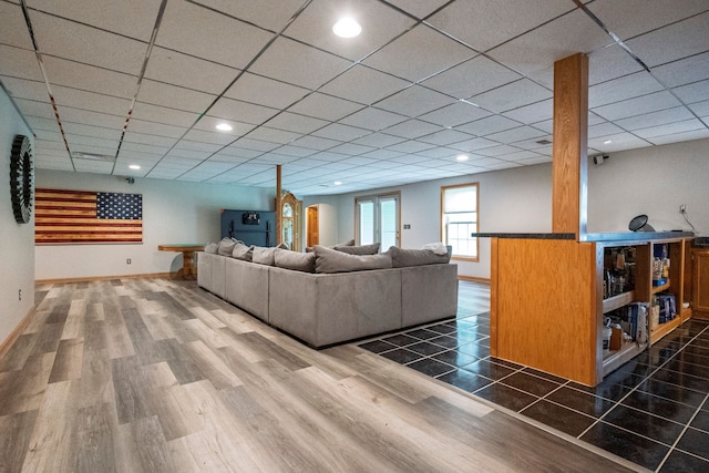 2363 Sundance Rdg, Howell, MI 48843 - living room with wood finished floors, baseboards, a paneled ceiling, and recessed lighting