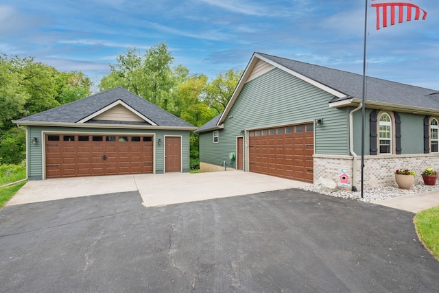 2363 Sundance Rdg, Howell, MI 48843 - view of side of home with brick siding and a shingled roof