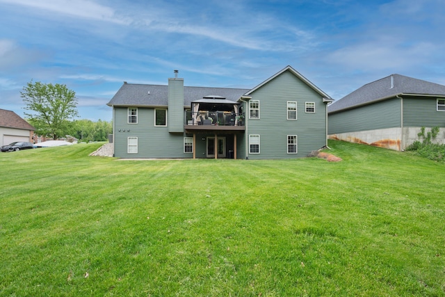 2363 Sundance Rdg, Howell, MI 48843 - rear view of house featuring a chimney, a deck, and a lawn