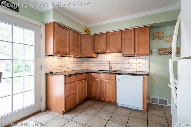3027 Ferris Ave, Royal Oak, MI 48073 - kitchen with white appliances, a sink, healthy amount of natural light, backsplash, and ornamental molding