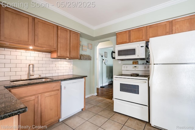 3027 Ferris Ave, Royal Oak, MI 48073 - kitchen featuring white appliances, a sink, light tile patterned floors, decorative backsplash, and ornamental molding
