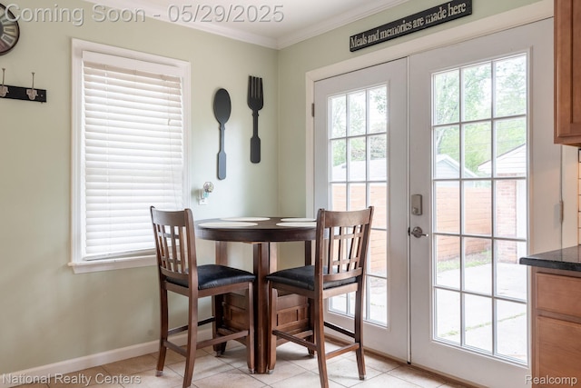 3027 Ferris Ave, Royal Oak, MI 48073 - dining area with healthy amount of natural light, baseboards, ornamental molding, and light tile patterned flooring