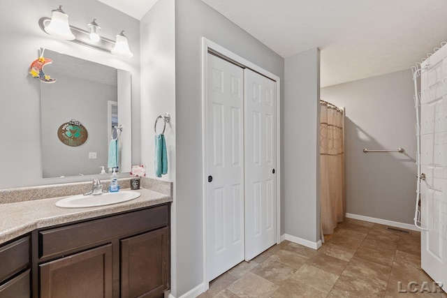 10623 Springville Hwy, Onsted, MI 49265 - bathroom featuring vanity and baseboards