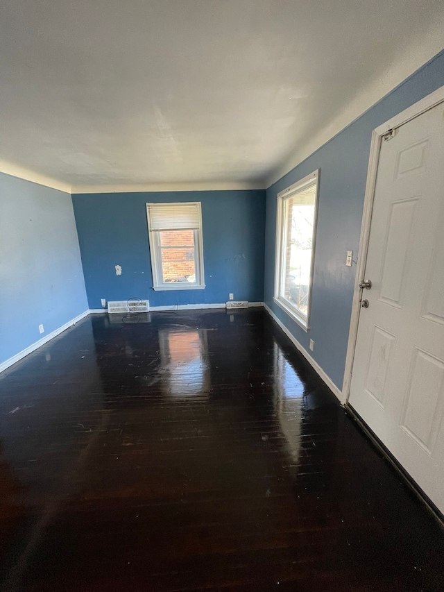 16500 Eastburn St, Detroit, MI 48205 - unfurnished room featuring hardwood / wood-style floors, healthy amount of natural light, and baseboards