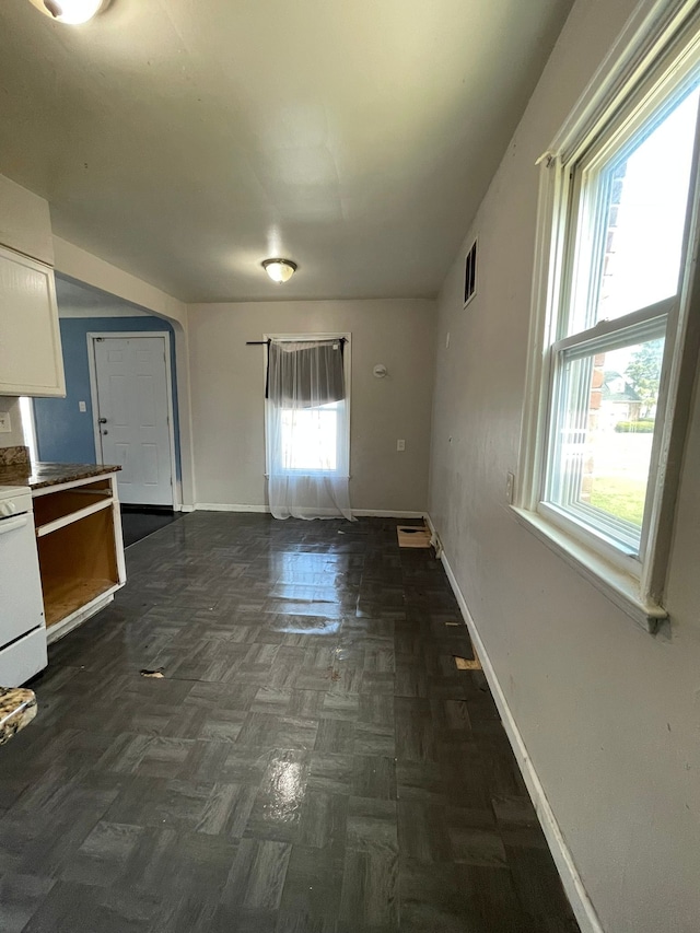 16500 Eastburn St, Detroit, MI 48205 - kitchen featuring range, white cabinetry, and baseboards
