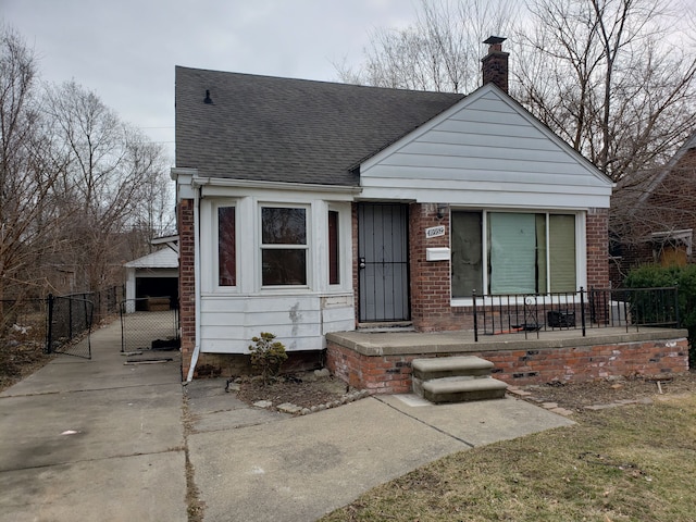 10952 Peerless St, Detroit, MI 48224 - bungalow featuring a shingled roof, a chimney, and a porch