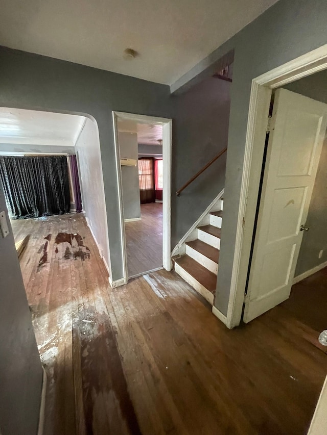 10952 Peerless St, Detroit, MI 48224 - hallway featuring wood-type flooring, stairway, and baseboards