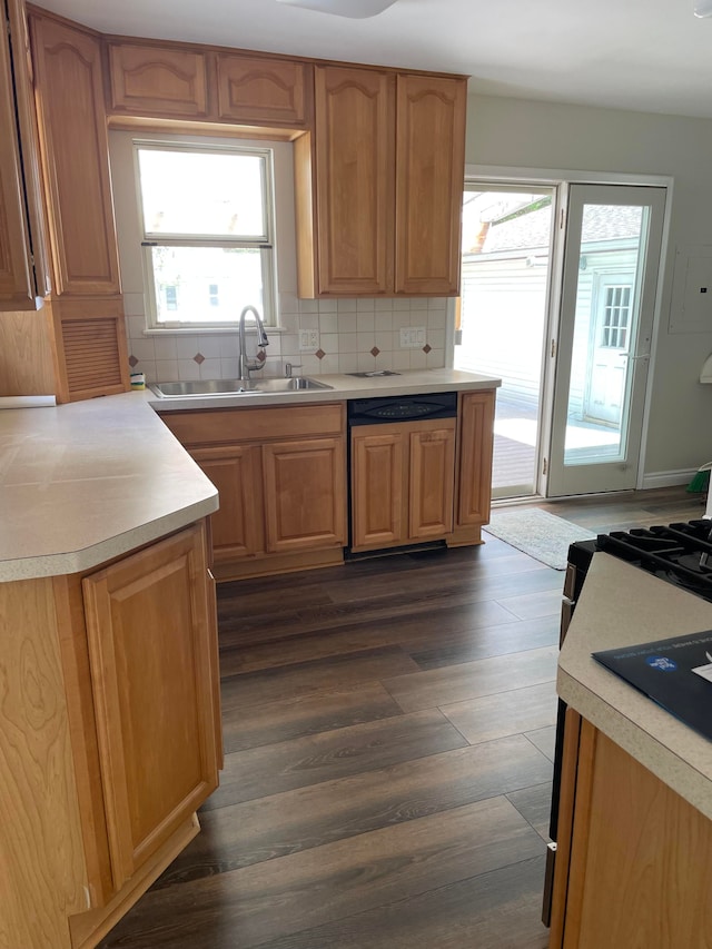 1659 Weymouth St, West Bloomfield, MI 48324 - kitchen with paneled dishwasher, a sink, dark wood finished floors, tasteful backsplash, and light countertops