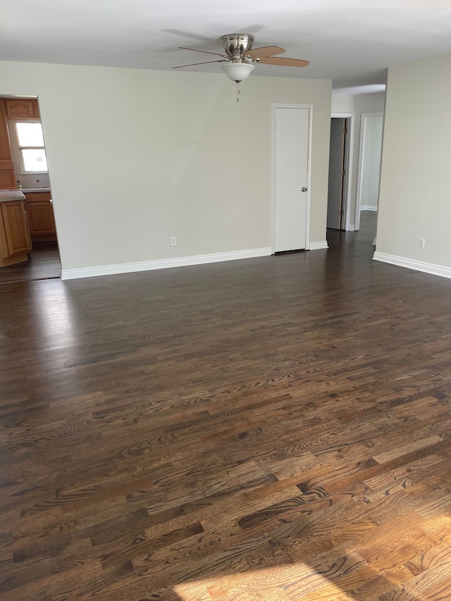 1659 Weymouth St, West Bloomfield, MI 48324 - unfurnished room with a ceiling fan, baseboards, and dark wood-style flooring