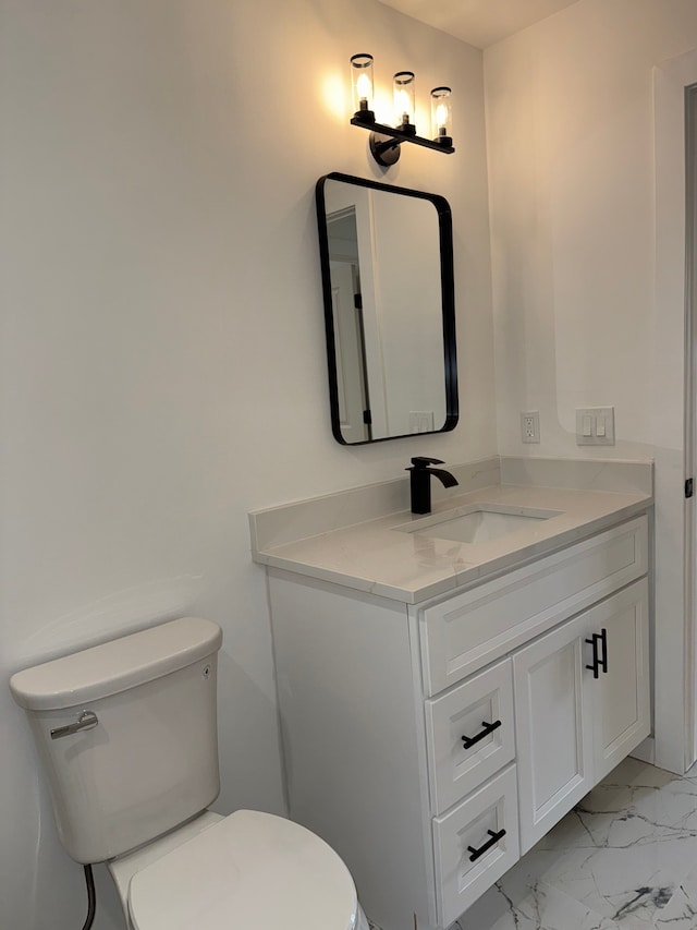42811 Wilmington Dr, Sterling Heights, MI 48313 - bathroom with toilet, marble finish floors, and vanity