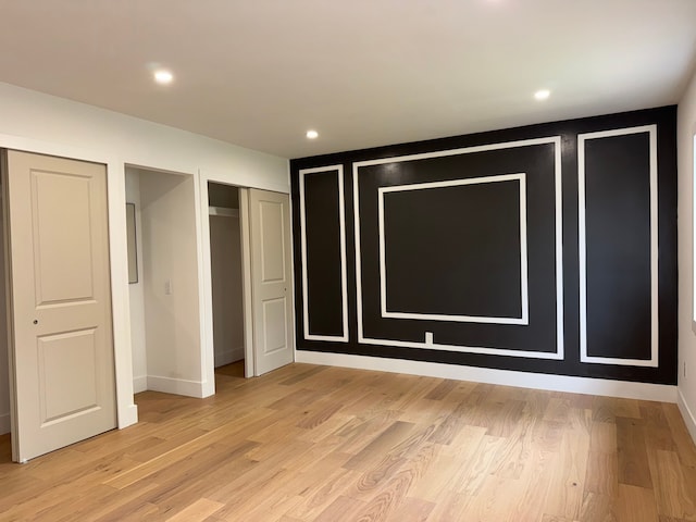 42811 Wilmington Dr, Sterling Heights, MI 48313 - unfurnished bedroom with light wood finished floors, baseboards, and recessed lighting