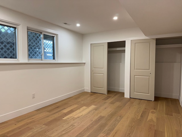 42811 Wilmington Dr, Sterling Heights, MI 48313 - unfurnished bedroom with baseboards, light wood-style flooring, and recessed lighting
