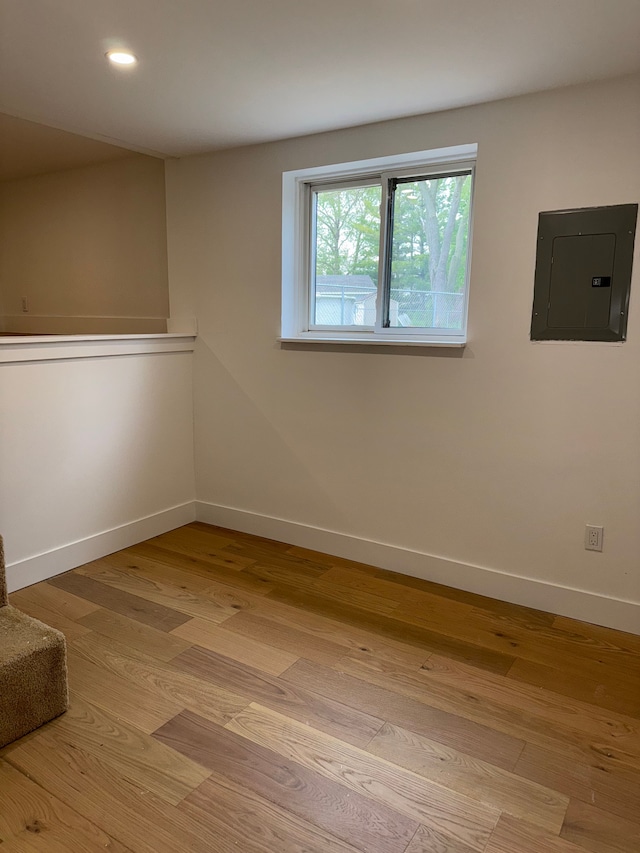 42811 Wilmington Dr, Sterling Heights, MI 48313 - unfurnished room with electric panel, baseboards, wood finished floors, and recessed lighting