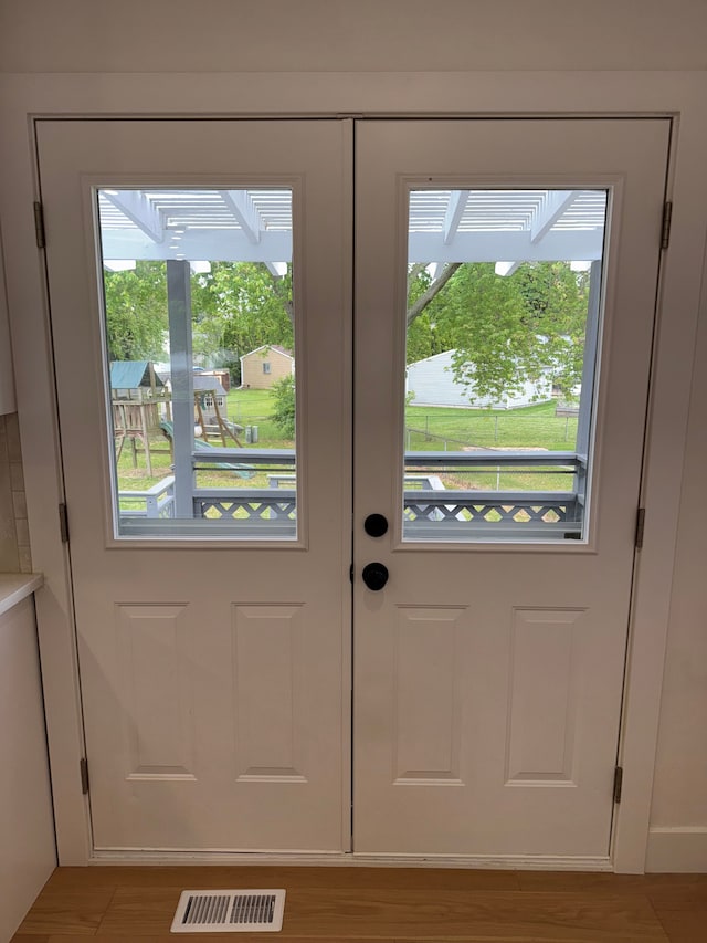42811 Wilmington Dr, Sterling Heights, MI 48313 - doorway to outside featuring wood finished floors