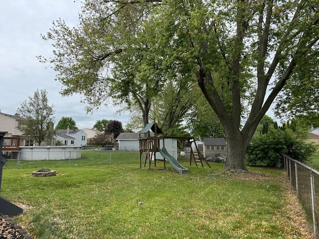 42811 Wilmington Dr, Sterling Heights, MI 48313 - view of yard featuring an outdoor fire pit and a playground