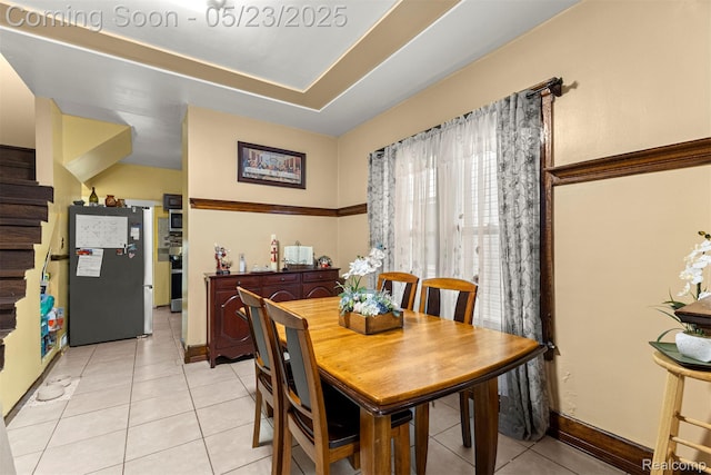 7295 Gartner St, Detroit, MI 48209 - dining space with light tile patterned flooring, stairway, and baseboards