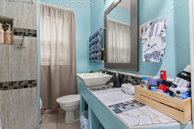 7295 Gartner St, Detroit, MI 48209 - bathroom featuring tile patterned flooring, vanity, toilet, and a shower