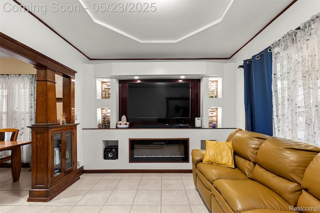 7295 Gartner St, Detroit, MI 48209 - living area featuring light tile patterned flooring, a glass covered fireplace, and a raised ceiling