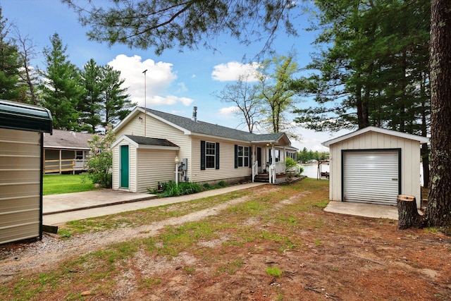 1797 Lawrence Dr, Bitely, MI 49309 - rear view of house featuring an outbuilding