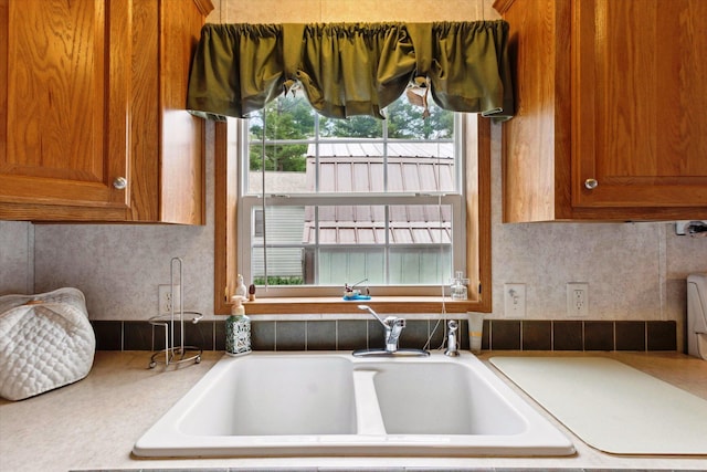 1797 Lawrence Dr, Bitely, MI 49309 - kitchen featuring brown cabinets, a sink, and light countertops