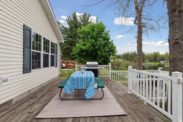 1797 Lawrence Dr, Bitely, MI 49309 - wooden deck featuring a grill and a water view