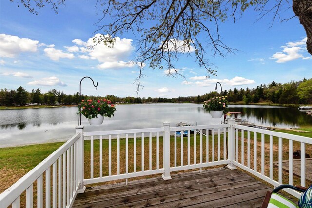 1797 Lawrence Dr, Bitely, MI 49309 - wooden terrace with a water view and a lawn