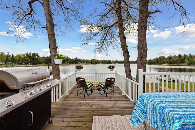 1797 Lawrence Dr, Bitely, MI 49309 - wooden deck featuring a water view and a grill