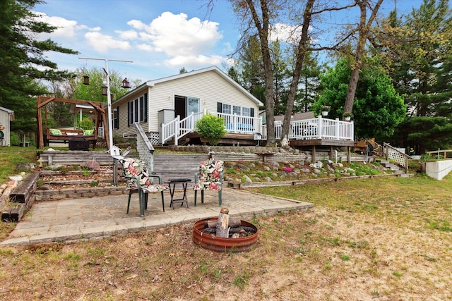 1797 Lawrence Dr, Bitely, MI 49309 - rear view of property featuring a deck, stairs, and a patio