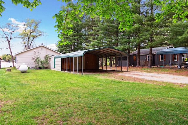 1797 Lawrence Dr, Bitely, MI 49309 - view of grassy yard with dirt driveway and a carport