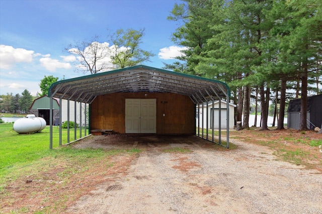 1797 Lawrence Dr, Bitely, MI 49309 - view of shed featuring a detached carport and dirt driveway