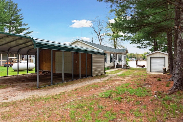 1797 Lawrence Dr, Bitely, MI 49309 - view of yard with a carport and driveway